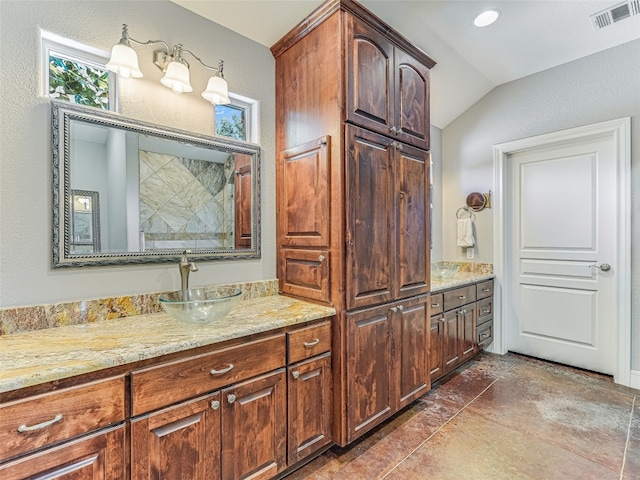 167 Manawianui Dr, Bastrop, TX 78602 - bathroom featuring vaulted ceiling, vanity, and tiled shower