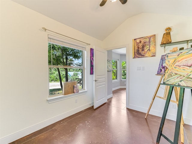 167 Manawianui Dr, Bastrop, TX 78602 - foyer entrance with concrete flooring, lofted ceiling, and a ceiling fan