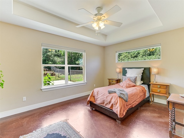 167 Manawianui Dr, Bastrop, TX 78602 - bedroom featuring a tray ceiling and ceiling fan