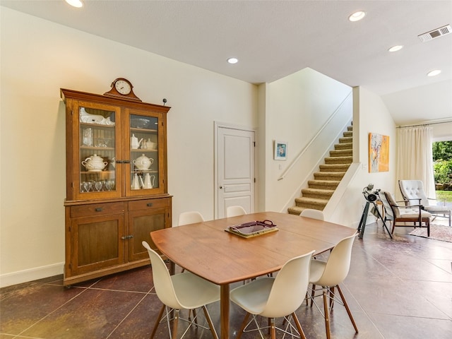 167 Manawianui Dr, Bastrop, TX 78602 - dining room featuring stairs, recessed lighting, and dark tile patterned floors