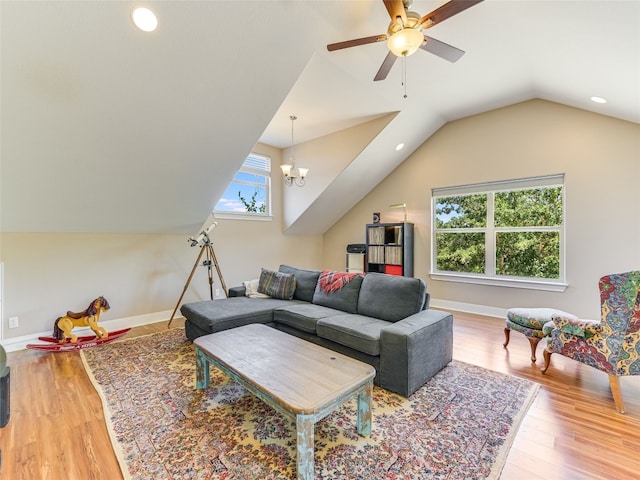 167 Manawianui Dr, Bastrop, TX 78602 - living room featuring ceiling fan, vaulted ceiling, wood finished floors, and recessed lighting
