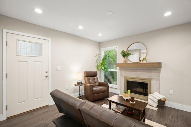 935 La Posada Dr Unit 148, Austin, TX 78752 - living area with wood finished floors, recessed lighting, and a tiled fireplace