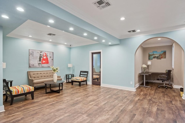 935 La Posada Dr Unit 148, Austin, TX 78752 - sitting room with crown molding, recessed lighting, arched walkways, and wood finished floors