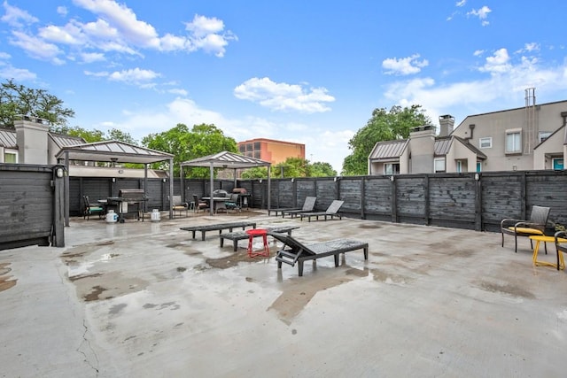 935 La Posada Dr Unit 148, Austin, TX 78752 - fenced backyard featuring a gazebo, a patio area, and grilling area