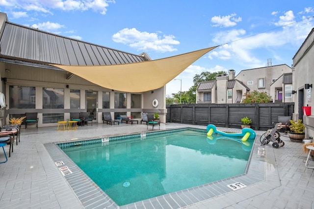 935 La Posada Dr Unit 148, Austin, TX 78752 - community pool featuring a fenced backyard and a patio area