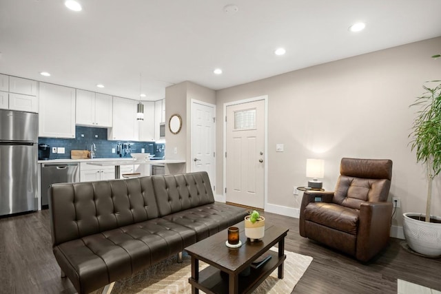 935 La Posada Dr Unit 148, Austin, TX 78752 - living room with dark wood-style floors and recessed lighting