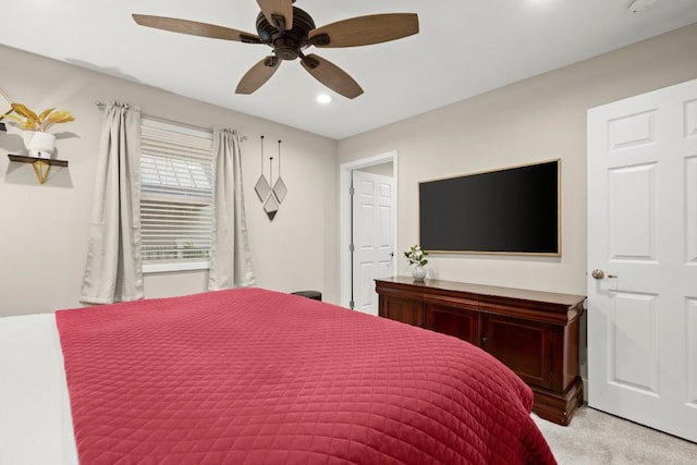 935 La Posada Dr Unit 148, Austin, TX 78752 - bedroom with light carpet, recessed lighting, and a ceiling fan