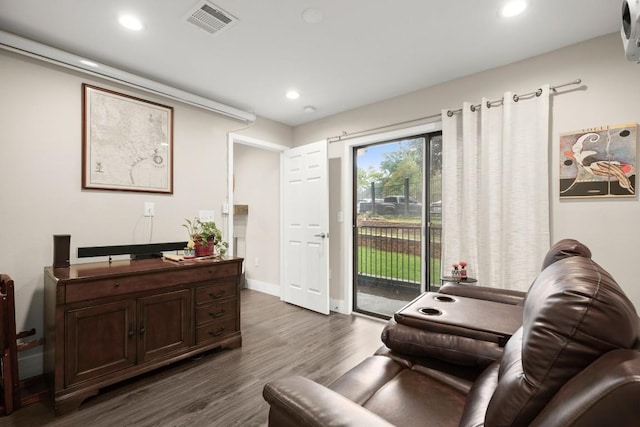 935 La Posada Dr Unit 148, Austin, TX 78752 - living room with dark wood-type flooring and recessed lighting