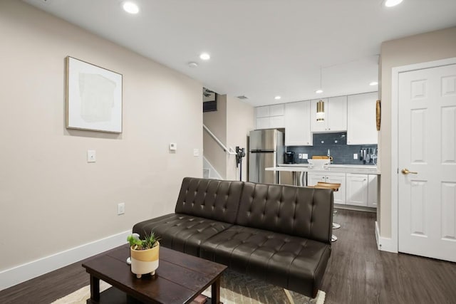 935 La Posada Dr Unit 148, Austin, TX 78752 - living room with recessed lighting, dark wood-type flooring, and stairs