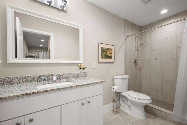 935 La Posada Dr Unit 148, Austin, TX 78752 - full bathroom with vanity, a tile shower, tile patterned floors, and recessed lighting