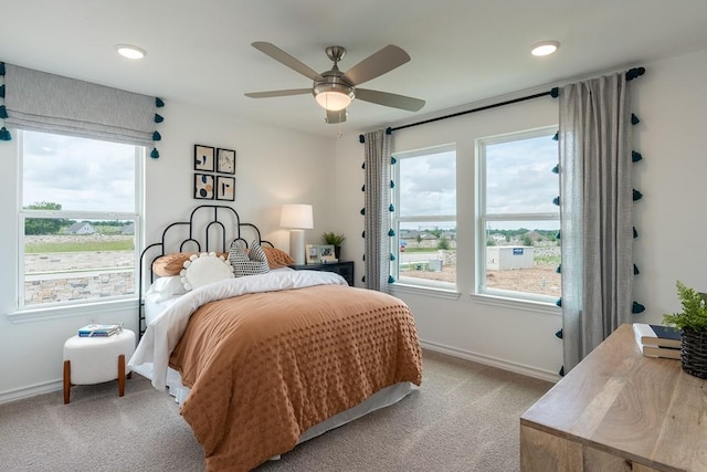 1425 Purple Martin Dr, Pflugerville, TX 78660 - bedroom with light colored carpet, a ceiling fan, and recessed lighting
