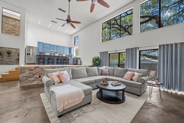 702 California Blvd Unit 702, New Braunfels, TX 78130 - living room featuring a high ceiling, concrete flooring, a ceiling fan, and recessed lighting