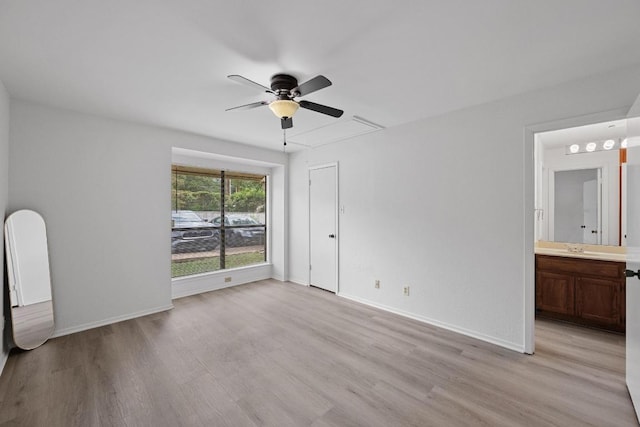 3801 Menchaca Rd Unit 6, Austin, TX 78704 - unfurnished bedroom featuring attic access, light wood finished floors, ensuite bath, and a ceiling fan