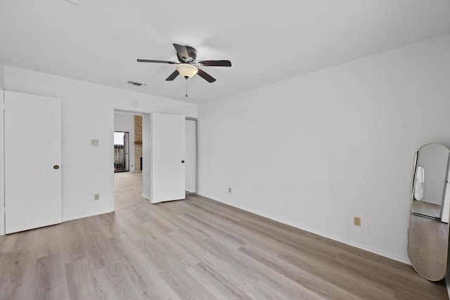 3801 Menchaca Rd Unit 6, Austin, TX 78704 - unfurnished bedroom featuring light wood-style floors and ceiling fan