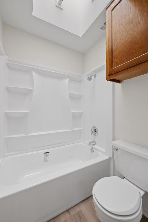 3801 Menchaca Rd Unit 6, Austin, TX 78704 - bathroom with wood finished floors and shower / bathtub combination