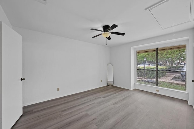 3801 Menchaca Rd Unit 6, Austin, TX 78704 - unfurnished room featuring attic access, wood finished floors, and ceiling fan