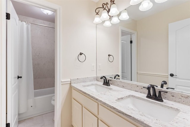 9527 Indigo Brush Dr, Austin, TX 78726 - bathroom with double vanity, a chandelier, shower / tub combo with curtain, and tile patterned floors