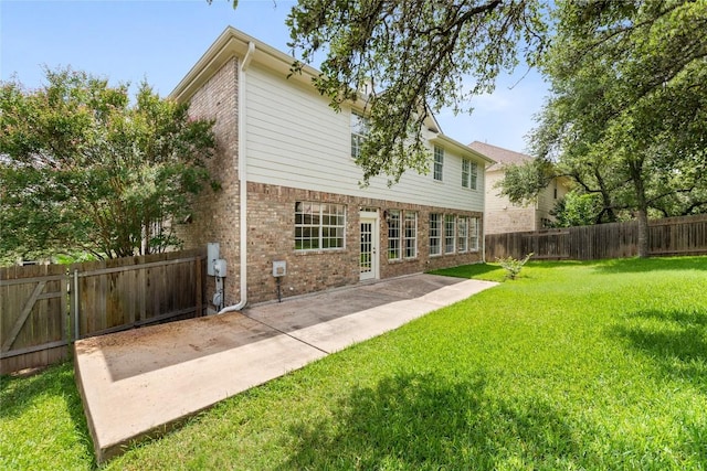 9527 Indigo Brush Dr, Austin, TX 78726 - rear view of property with brick siding, a patio area, and a fenced backyard