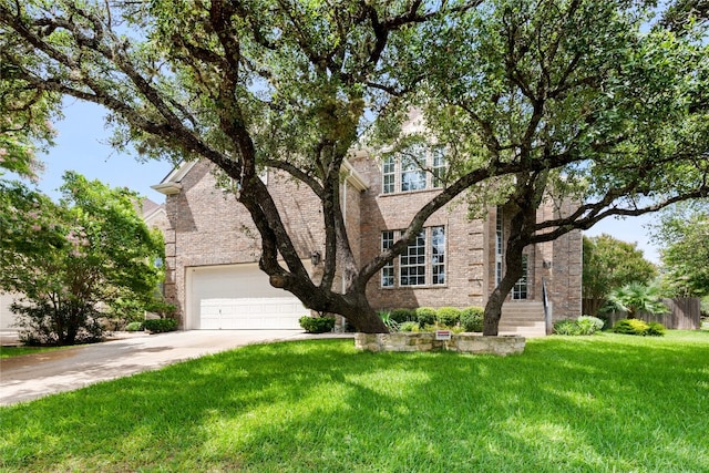 9527 Indigo Brush Dr, Austin, TX 78726 - view of front of property with brick siding, concrete driveway, and a front lawn