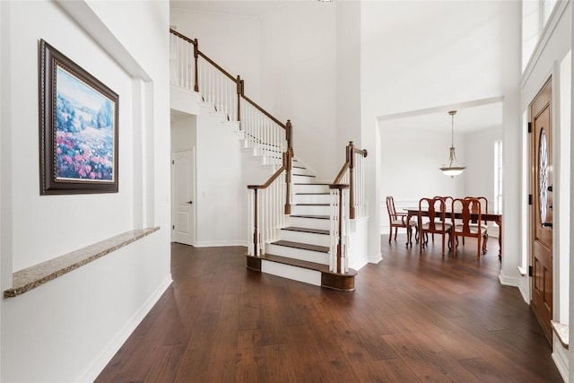 9527 Indigo Brush Dr, Austin, TX 78726 - entryway with a towering ceiling, stairs, and dark wood-style floors
