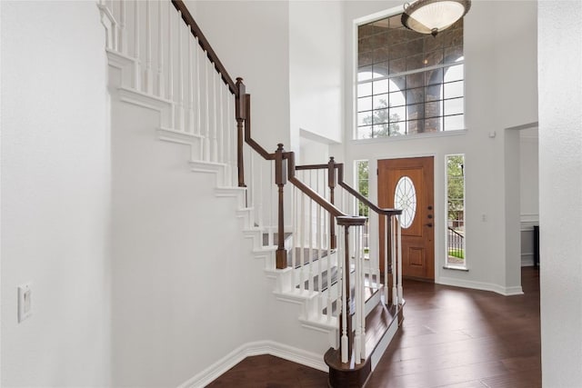 9527 Indigo Brush Dr, Austin, TX 78726 - entryway featuring a towering ceiling, stairway, and dark wood-style flooring
