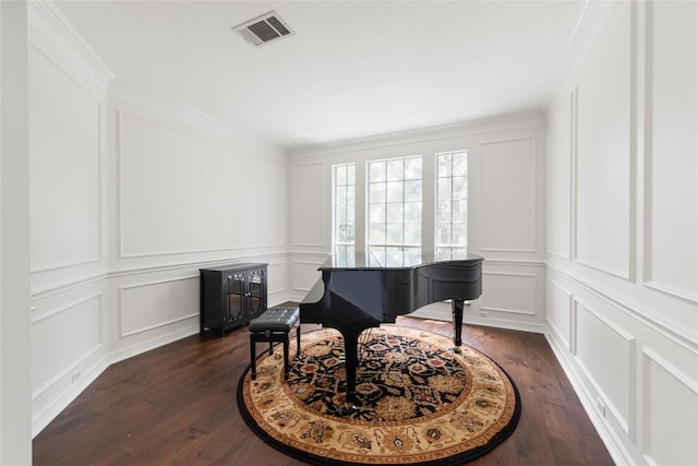 9527 Indigo Brush Dr, Austin, TX 78726 - sitting room featuring a decorative wall, dark wood-style floors, and crown molding