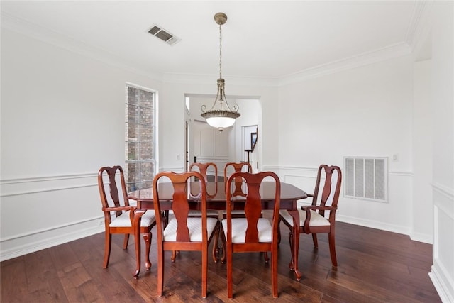 9527 Indigo Brush Dr, Austin, TX 78726 - dining space featuring ornamental molding, dark wood finished floors, a wainscoted wall, and a decorative wall