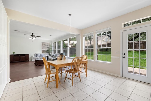 9527 Indigo Brush Dr, Austin, TX 78726 - dining space with a chandelier and light tile patterned floors