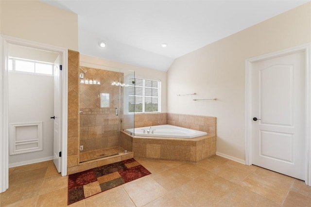 9527 Indigo Brush Dr, Austin, TX 78726 - bathroom with a bath, a stall shower, tile patterned flooring, and lofted ceiling