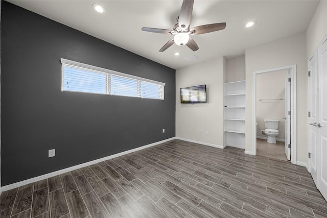 7808 Glover Dr, Austin, TX 78744 - unfurnished bedroom featuring recessed lighting, wood finished floors, connected bathroom, and a ceiling fan