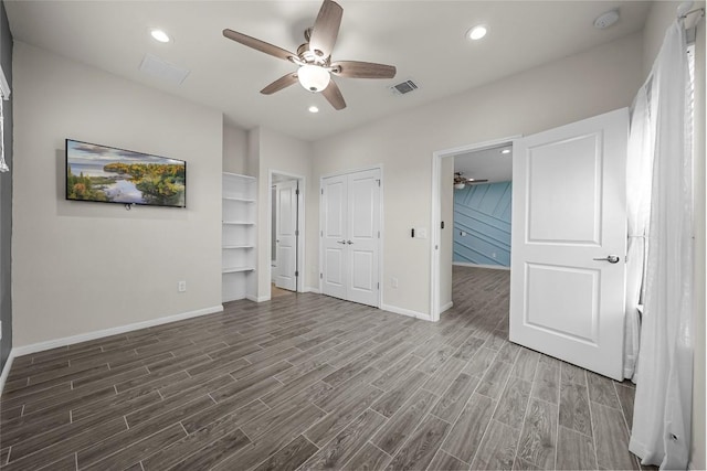 7808 Glover Dr, Austin, TX 78744 - unfurnished bedroom featuring wood finished floors, recessed lighting, a closet, and a ceiling fan