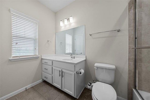 7808 Glover Dr, Austin, TX 78744 - bathroom featuring vanity, tile patterned floors, and bath / shower combo with glass door