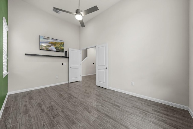 7808 Glover Dr, Austin, TX 78744 - empty room featuring high vaulted ceiling, wood finished floors, and ceiling fan