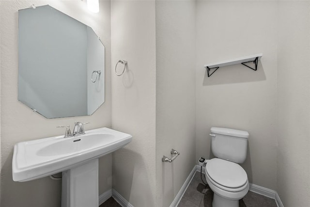 7808 Glover Dr, Austin, TX 78744 - bathroom featuring toilet and tile patterned flooring