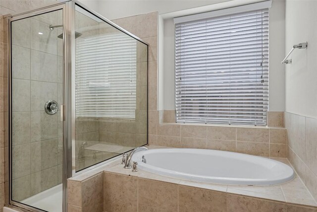 7808 Glover Dr, Austin, TX 78744 - full bathroom featuring a garden tub and a stall shower