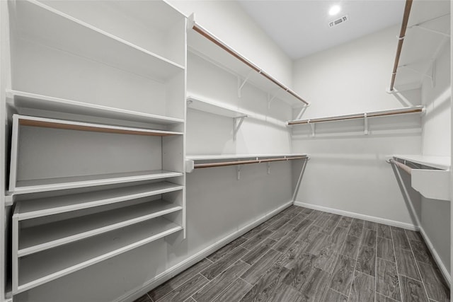 7808 Glover Dr, Austin, TX 78744 - spacious closet featuring dark wood-style flooring