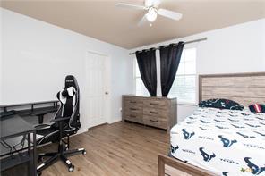 5516 Birmingham Dr, Killeen, TX 76542 - bedroom featuring wood finished floors and ceiling fan