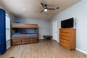 5516 Birmingham Dr, Killeen, TX 76542 - bedroom with vaulted ceiling, wood finished floors, and ceiling fan