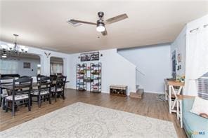 5516 Birmingham Dr, Killeen, TX 76542 - dining space with a ceiling fan, wood finished floors, and a chandelier