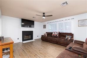 5516 Birmingham Dr, Killeen, TX 76542 - living area with a ceiling fan, wood finished floors, and a large fireplace
