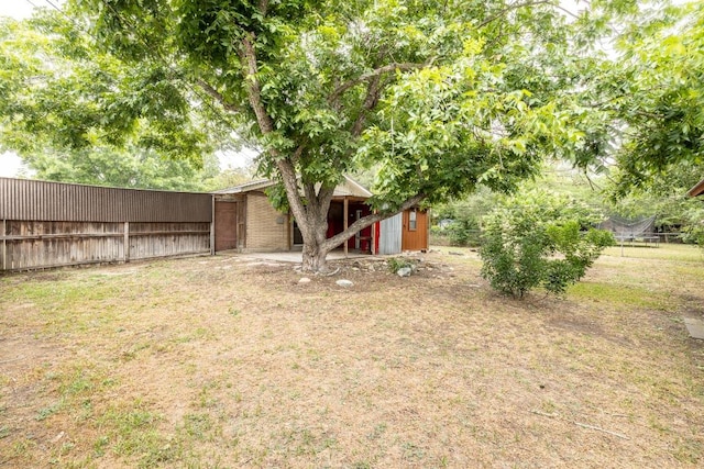 705 Dunning St, Gonzales, TX 78629 - view of yard featuring a storage unit
