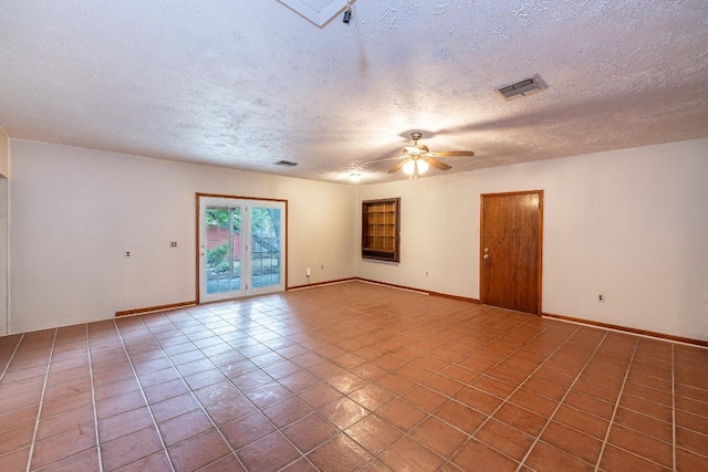 705 Dunning St, Gonzales, TX 78629 - tiled empty room with a ceiling fan and a textured ceiling