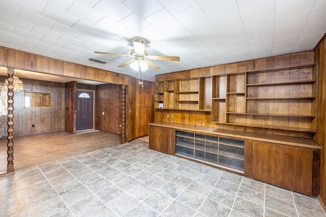 705 Dunning St, Gonzales, TX 78629 - bar with wood walls and ceiling fan