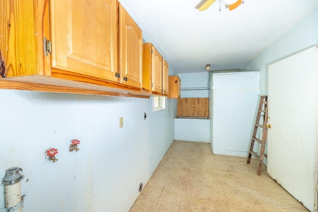 705 Dunning St, Gonzales, TX 78629 - washroom with light floors, cabinet space, and ceiling fan