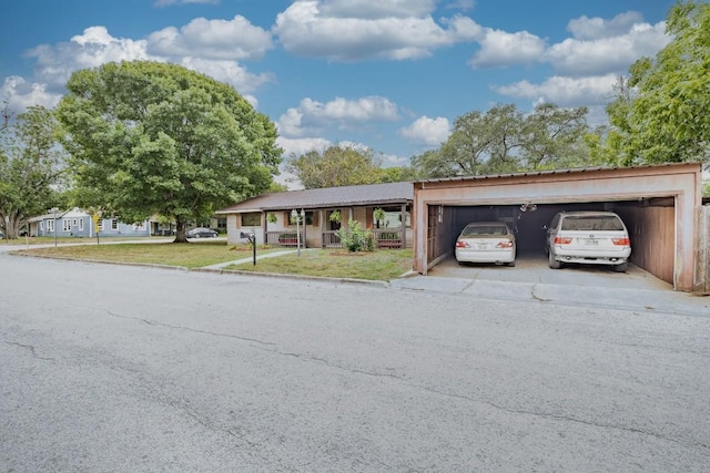 705 Dunning St, Gonzales, TX 78629 - view of front of property with a garage, concrete driveway, and a front lawn