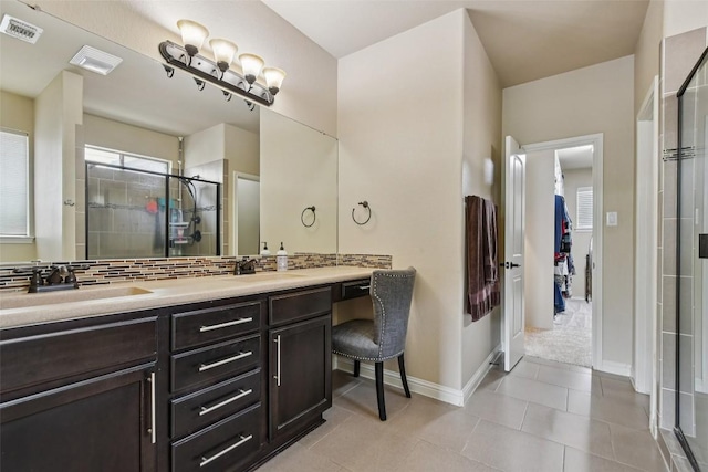 3713 Glastonbury Trl, Pflugerville, TX 78660 - full bathroom with double vanity, a shower stall, tile patterned floors, and tasteful backsplash