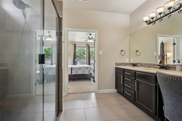 3713 Glastonbury Trl, Pflugerville, TX 78660 - ensuite bathroom featuring double vanity, a ceiling fan, a shower with shower door, and tile patterned floors