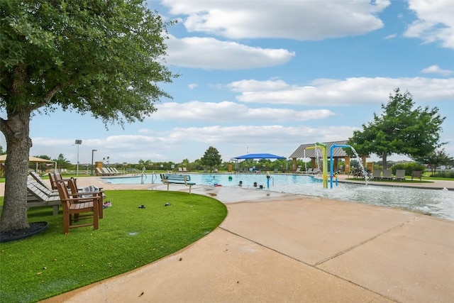 3713 Glastonbury Trl, Pflugerville, TX 78660 - view of property's community featuring a pool, a lawn, and a patio