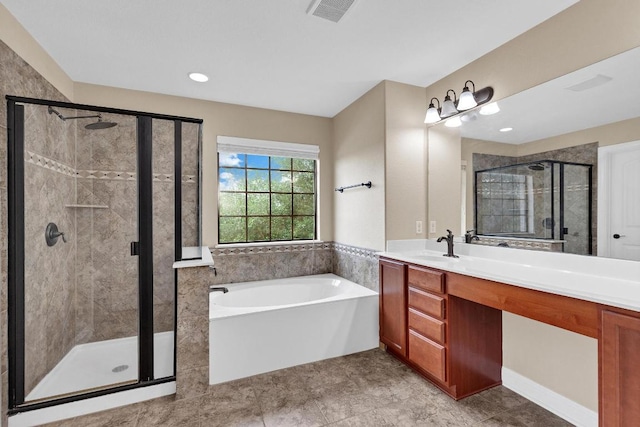 301 Wye Oak St, Austin, TX 78748 - full bathroom with a garden tub, vanity, a stall shower, recessed lighting, and tile patterned flooring
