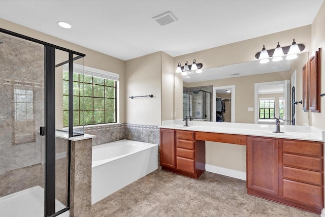 301 Wye Oak St, Austin, TX 78748 - full bathroom with double vanity, a garden tub, a stall shower, and tile patterned flooring